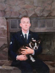 Portrait of a man in a suit holding his dog